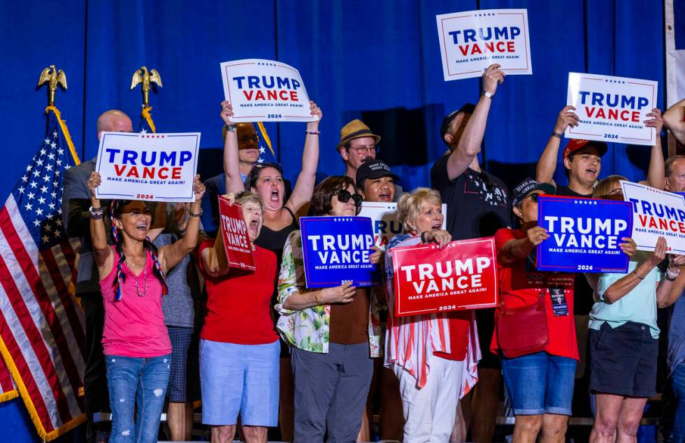 Supporters cheer as they stand behind Ohio Senator JD Vance delivering remarks during a rally a ...