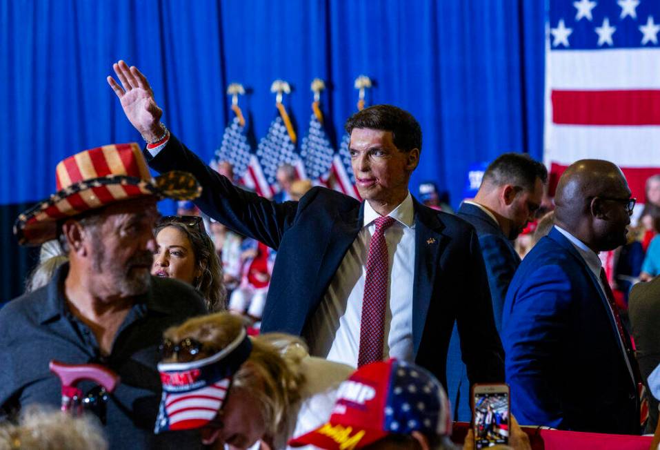 U.S. Senate candidate Sam Brown waves to supporters before a rally at Liberty High School on Tu ...