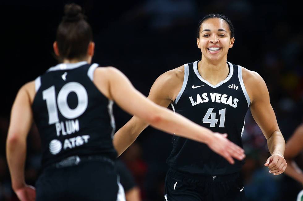 Las Vegas Aces center Kiah Stokes (41) celebrates with guard Kelsey Plum (10) after scoring a t ...