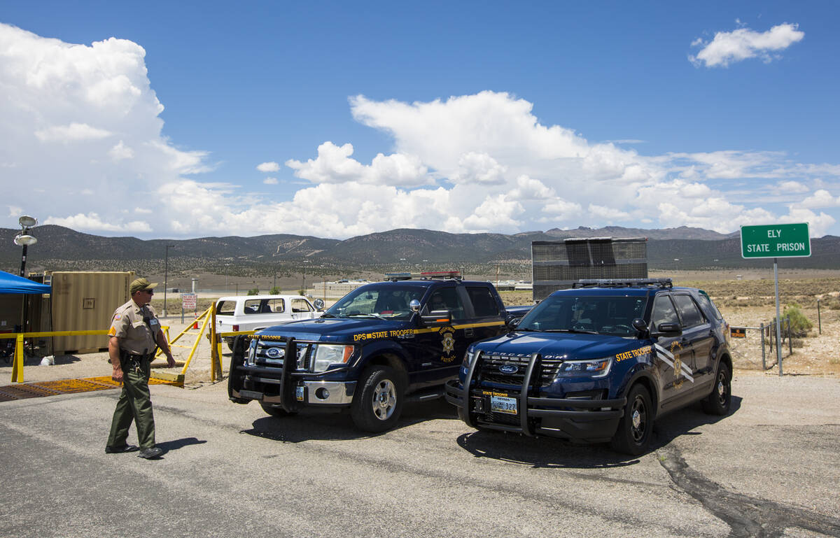 Law enforcement officials guard the entrance to Ely State Prison in Ely on Wednesday, July 11, ...