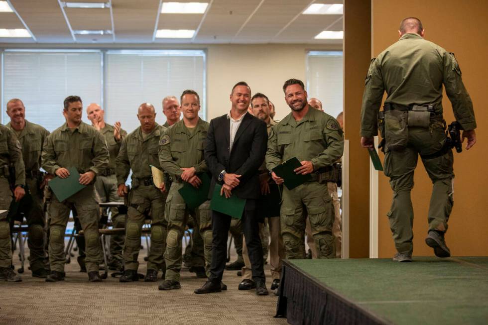 Metropolitan Police Department SWAT officers watch other officers cross the stage to receive th ...