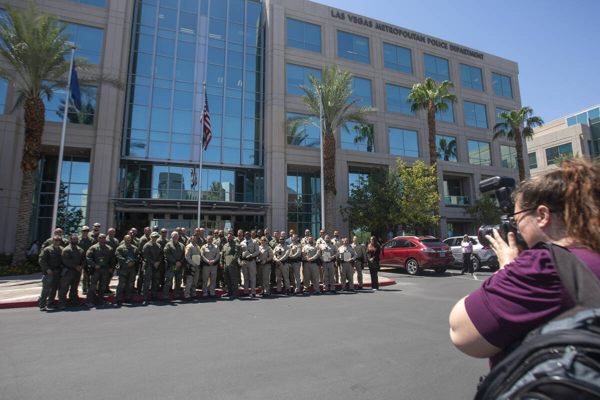 Award recipients take a group photograph after the Metropolitan Police Department’s comm ...