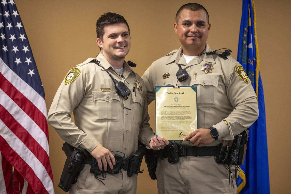 Officer Matthew Nardone, left, and Officer Antonio Valencia-Barajas, right, pose for photograph ...