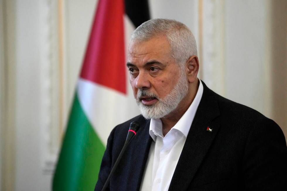 FILE - Hamas chief Ismail Haniyeh speaks during a press briefing after his meeting with Iranian ...