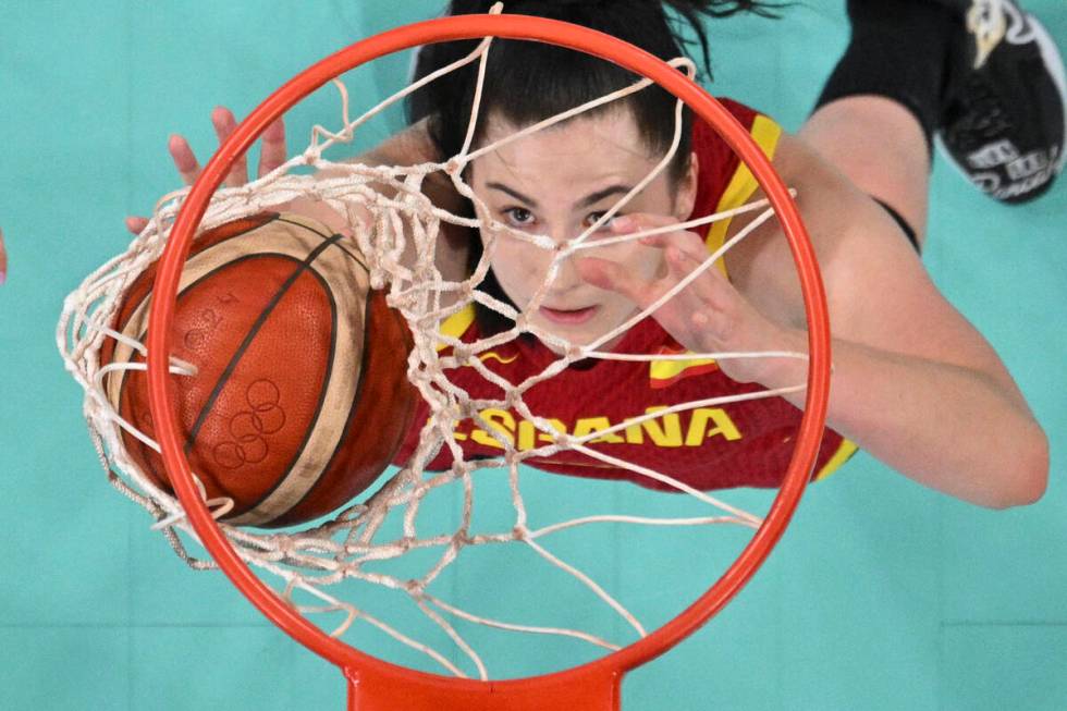 Megan Gustafson, of Spain, watches her shot fall through the basket in a games against Puerto R ...