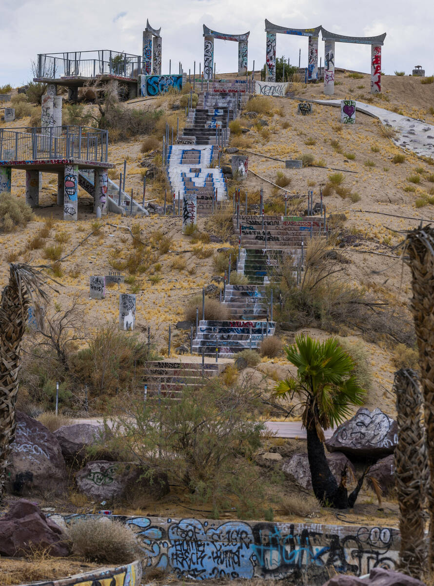 A water slide hill is dismantled and covered in graffiti at the former Rock-A-Hoola Water Park ...