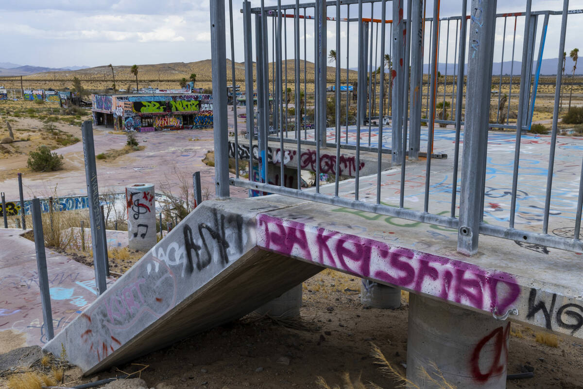 A water slide hill is dismantled and covered in graffiti at the former Rock-A-Hoola Water Park ...