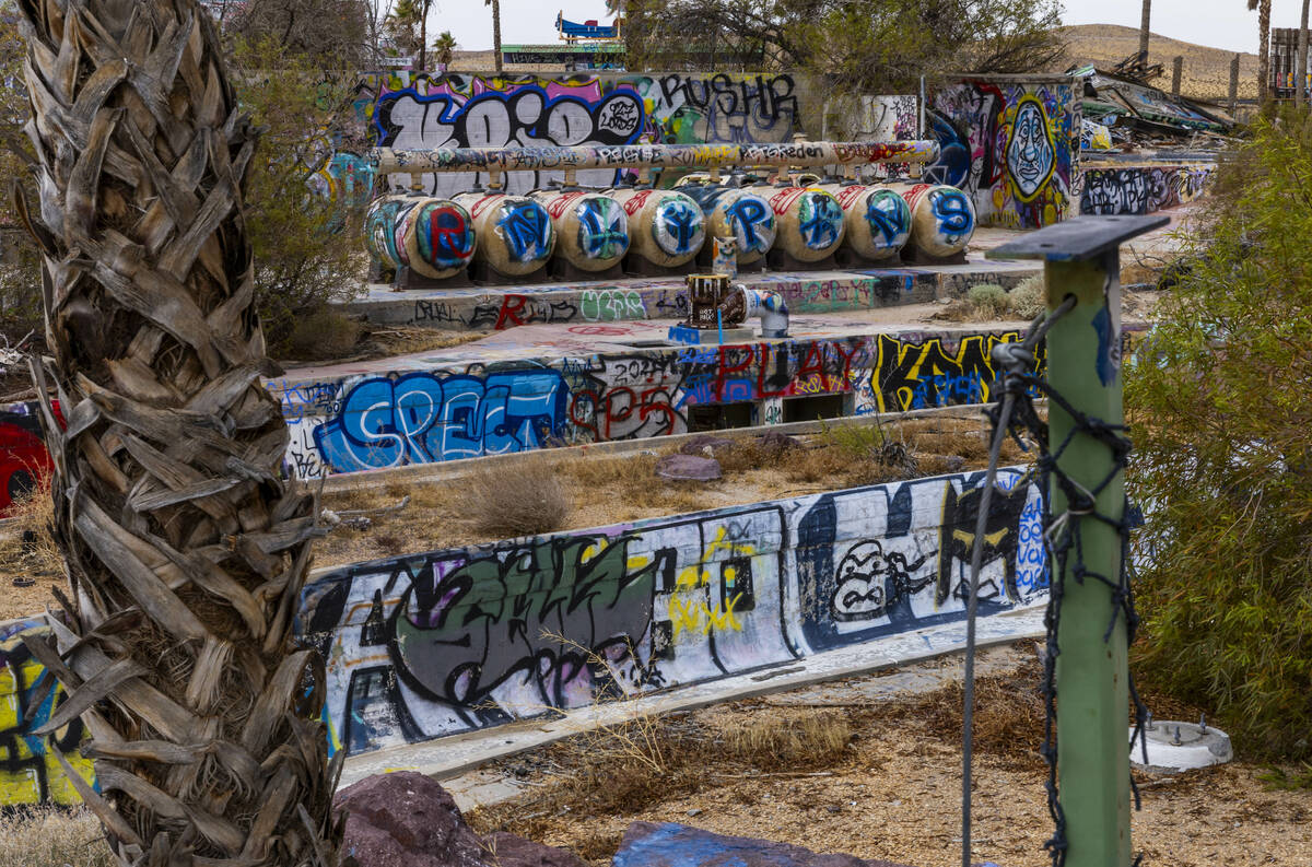 Graffiti covers most of the remaining structures at the former Rock-A-Hoola Water Park on Tuesd ...