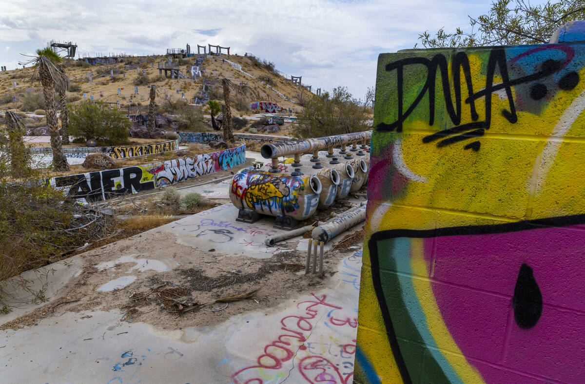 Graffiti covers most of the remaining structures at the former Rock-A-Hoola Water Park on Tuesd ...