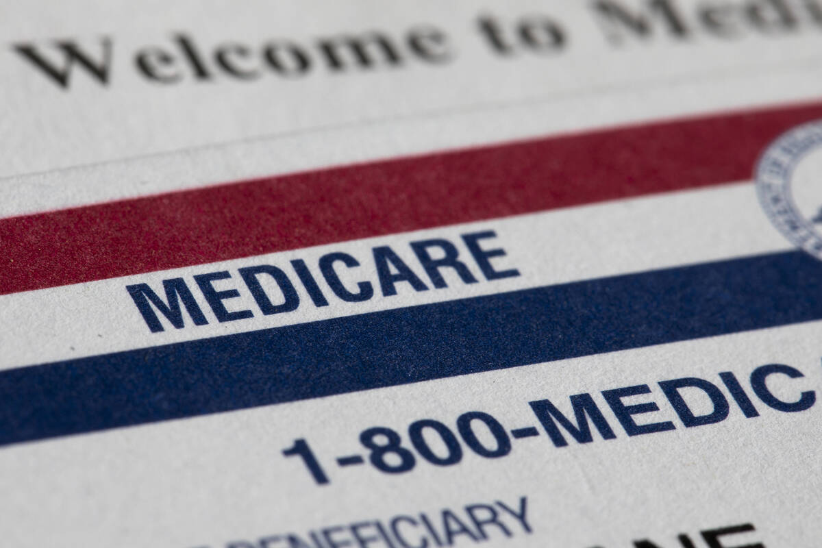 A Medicare card rests on top of a letter that says "Welcome to Medicare" on Monday, J ...