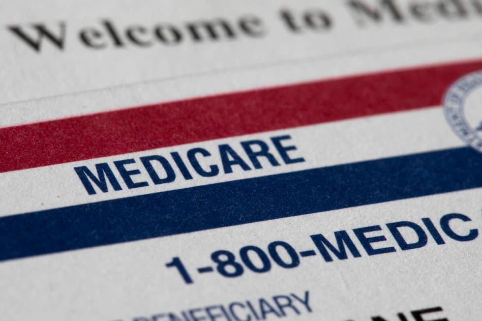 A Medicare card rests on top of a letter that says "Welcome to Medicare" on Monday, J ...