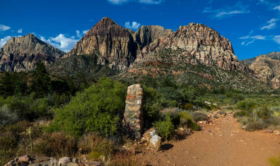 A stone marker along the Pine Creek Trail which holds the former Horace Wilson homestead within ...