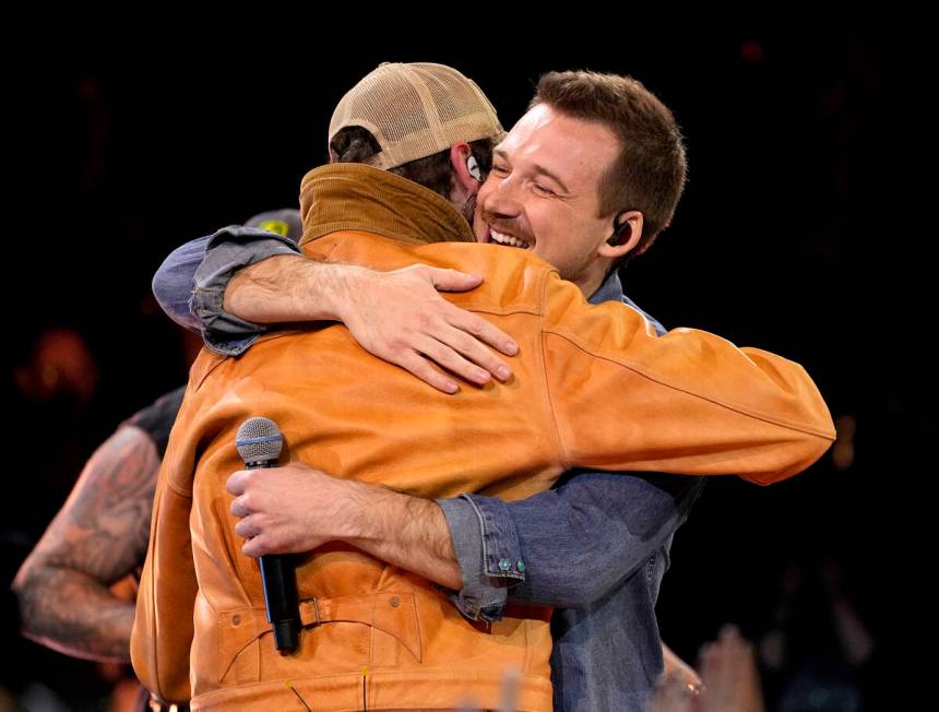 Post Malone, left, and Morgan Wallen perform a medley at the 57th Annual CMA Awards on Wednesda ...