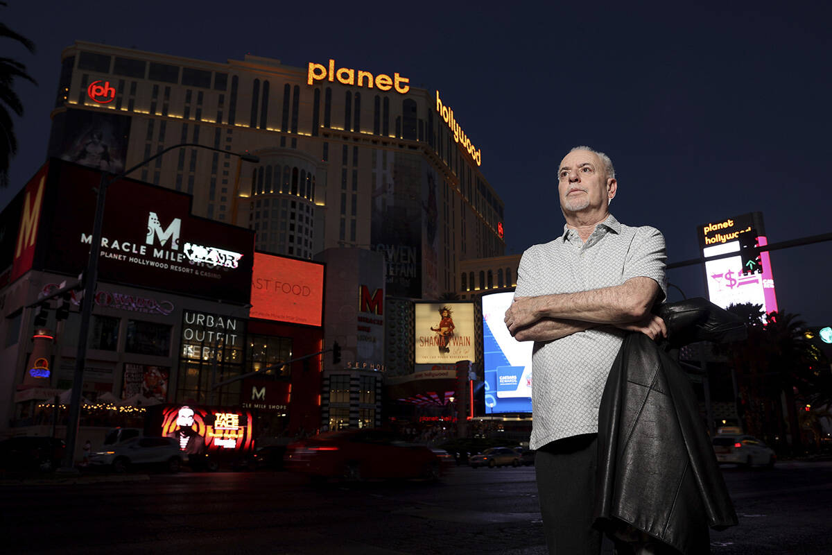 Review-Journal reporter Jeff German poses with Planet Hollywood, formerly the Aladdin, in the b ...