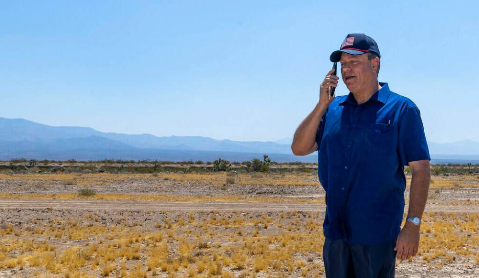 Spaceport CEO Rob Lauer makes a call while out on the empty land he plans to build on outside o ...