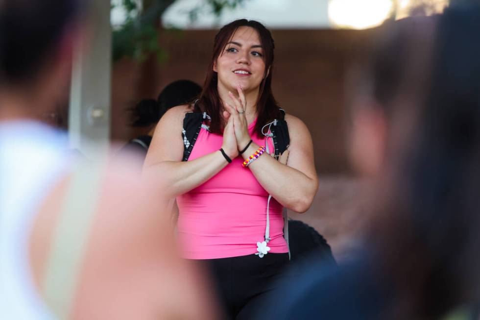 Michelle Way, the founder of Las Vegas Girls Run Club, speaks to a group of runners during a me ...