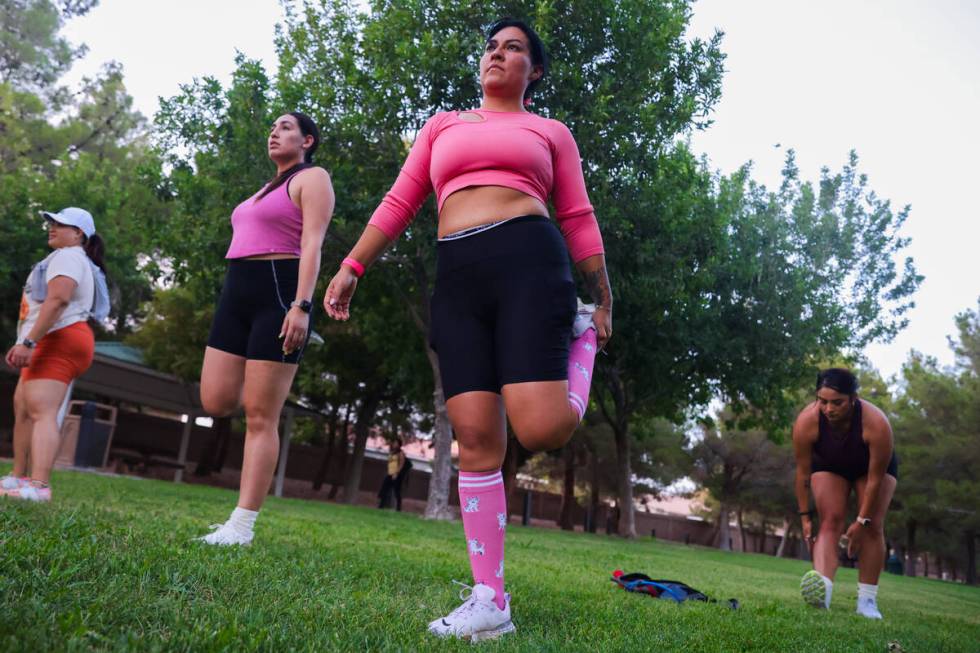 Maria Chairez stretches before a run during a Las Vegas Girls Run Club meeting at Seastrand Par ...