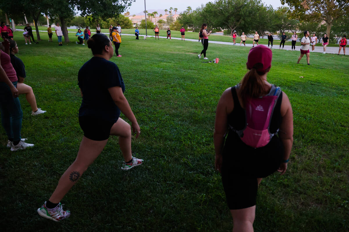 Las Vegas Girls Run Club members gather for a group warmup at Seastrand Park on Wednesday, Aug. ...