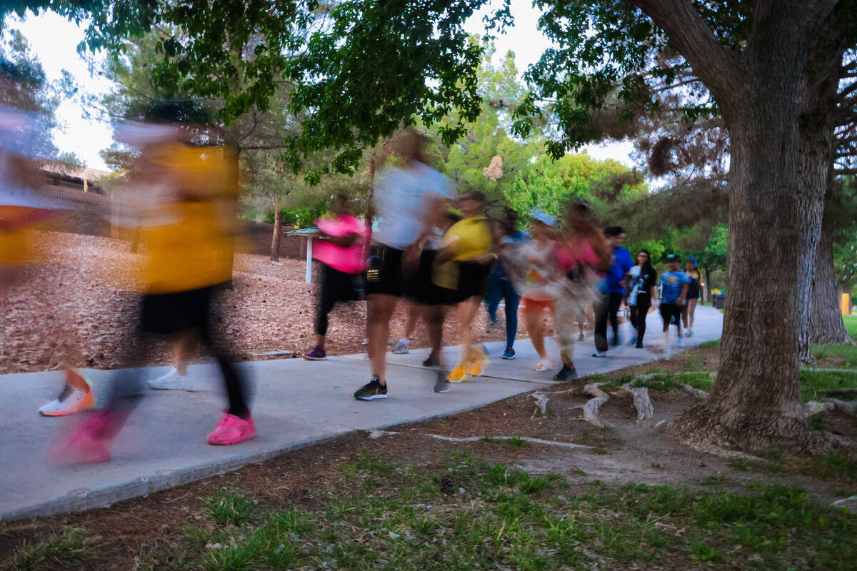 Runners begin taking to their routes during a Las Vegas Girls Run Club meeting at Seastrand Par ...