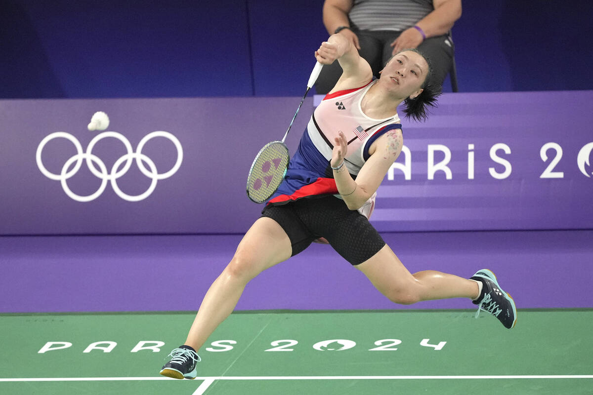 United States' Beiwen Zhang plays against Spain's Carolina Marin during their women's singles b ...