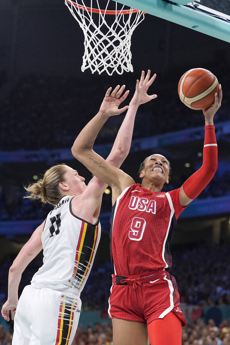 United States' A'ja Wilson, right, shoots as Belgium's Emma Meesseman defends during a women's ...