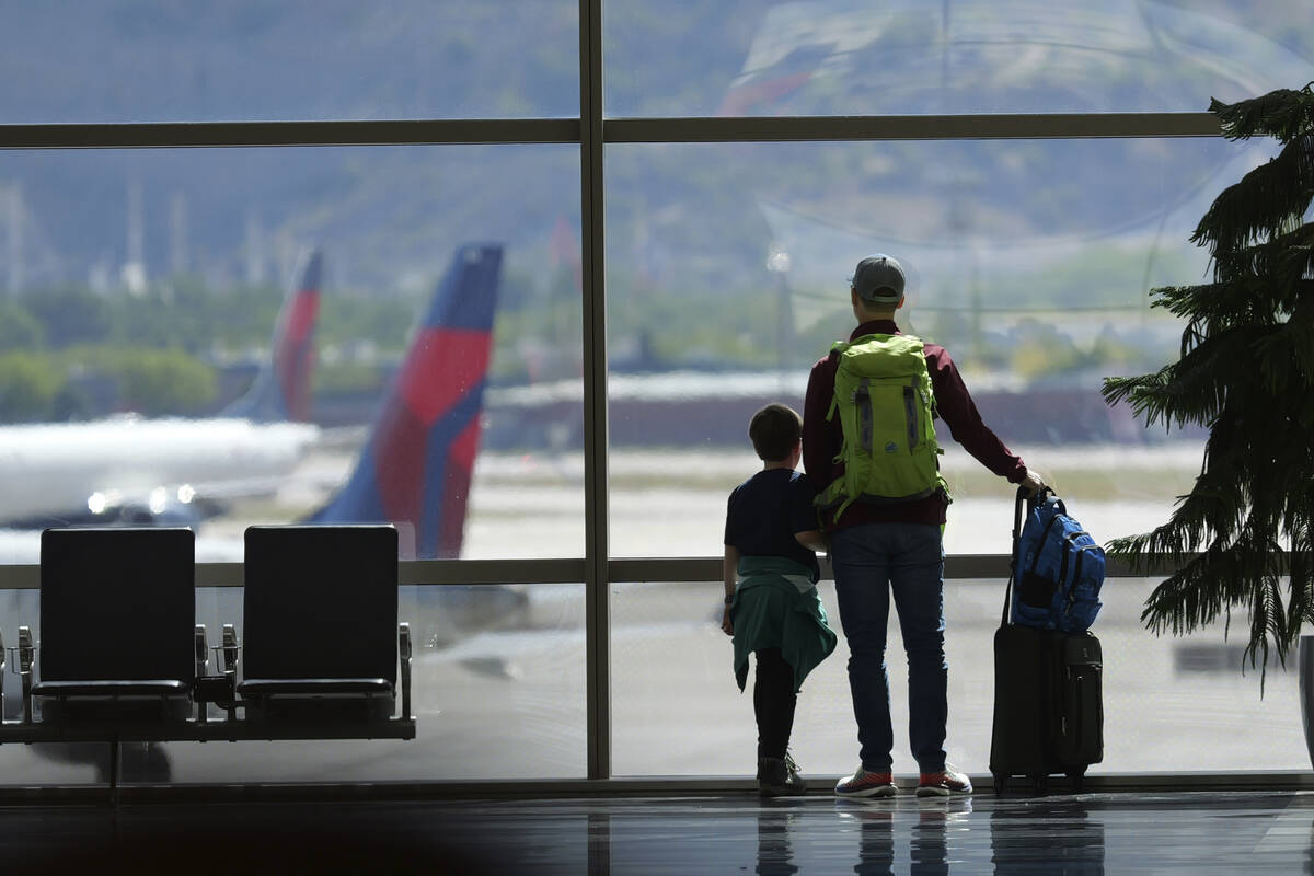 Travelers pass through Salt Lake City International Airport on May 24, 2024, in Salt Lake City. ...