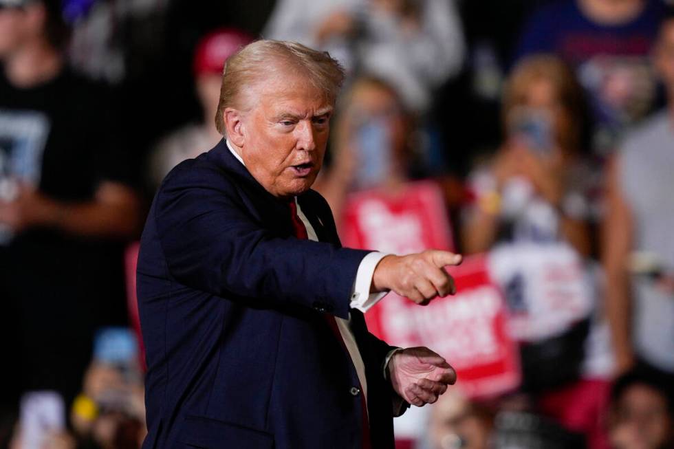 Republican presidential candidate former President Donald Trump gestures during a campaign rall ...