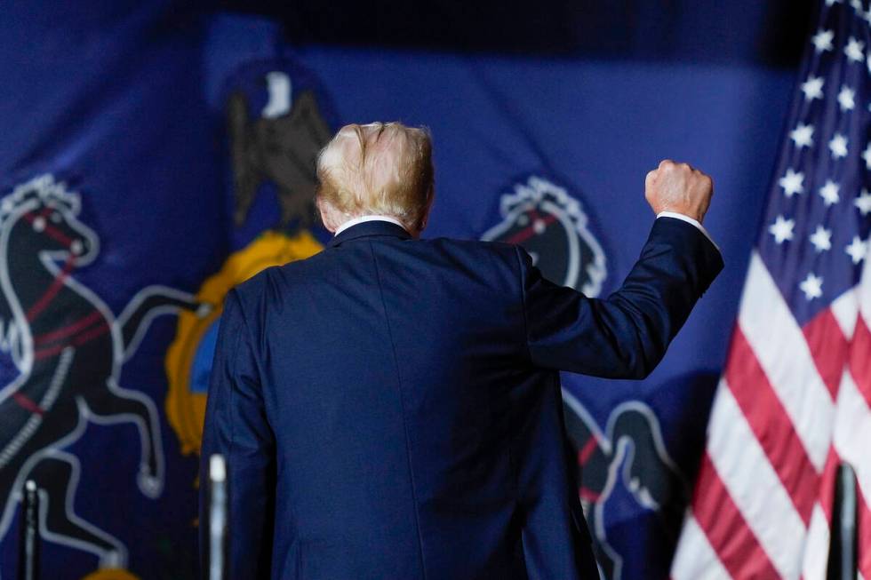 Republican presidential candidate former President Donald Trump gestures as he walks off stage ...