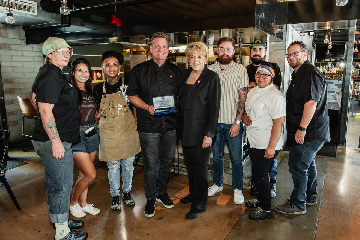 Cory Harwell, center, owner of Carson Kitchen in downtown Las Vegas received a key to the city ...