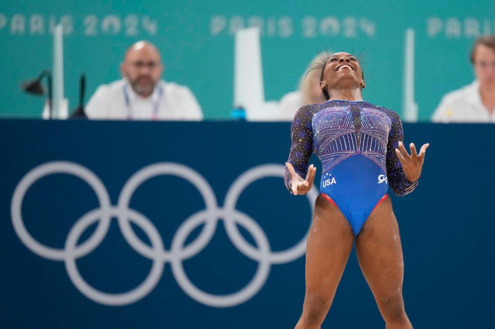 Simone Biles, of the United States, performs on the floor during the women's artistic gymnastic ...