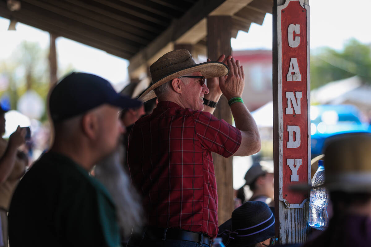 Spectators watch the parade make its way down Highway 95 during Goldfield Days on Saturday, Aug ...