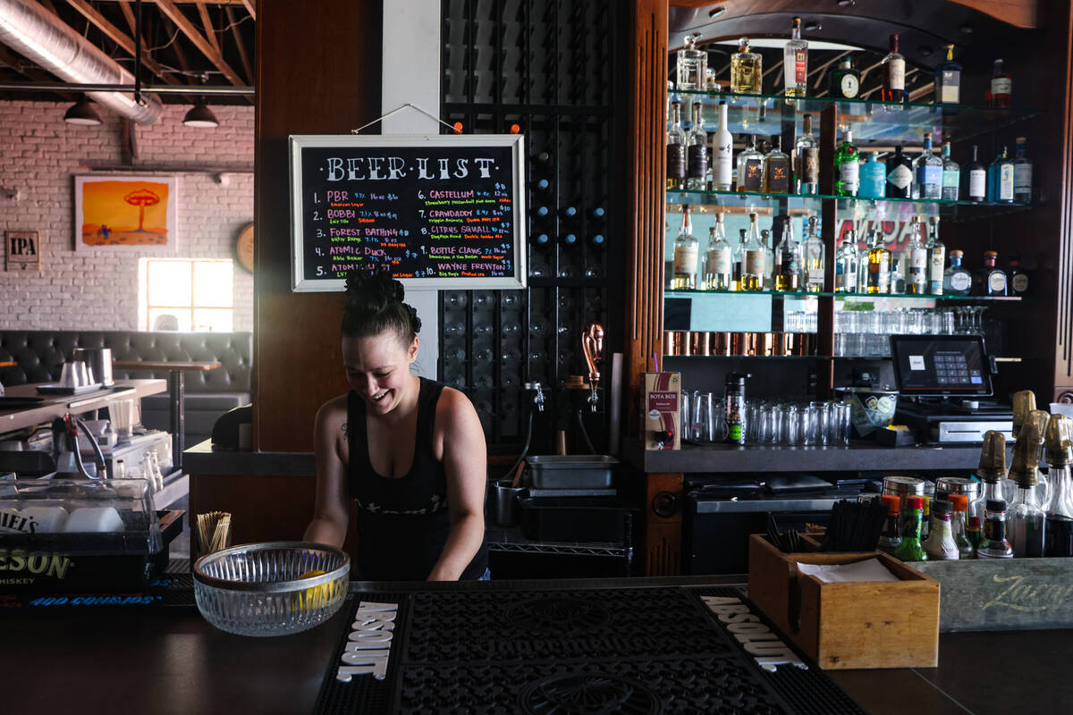 Bartender and server Athena Young preps the bar area during her shift at Atomic Kitchen in Las ...