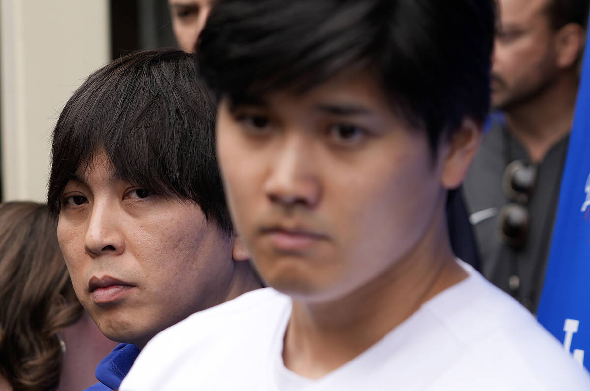 FILE - Ippei Mizuhara, left, stands next to Los Angeles Dodgers baseball player Shohei Ohtani, ...