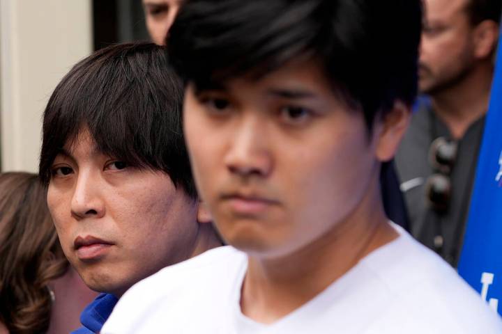 FILE - Ippei Mizuhara, left, stands next to Los Angeles Dodgers baseball player Shohei Ohtani, ...