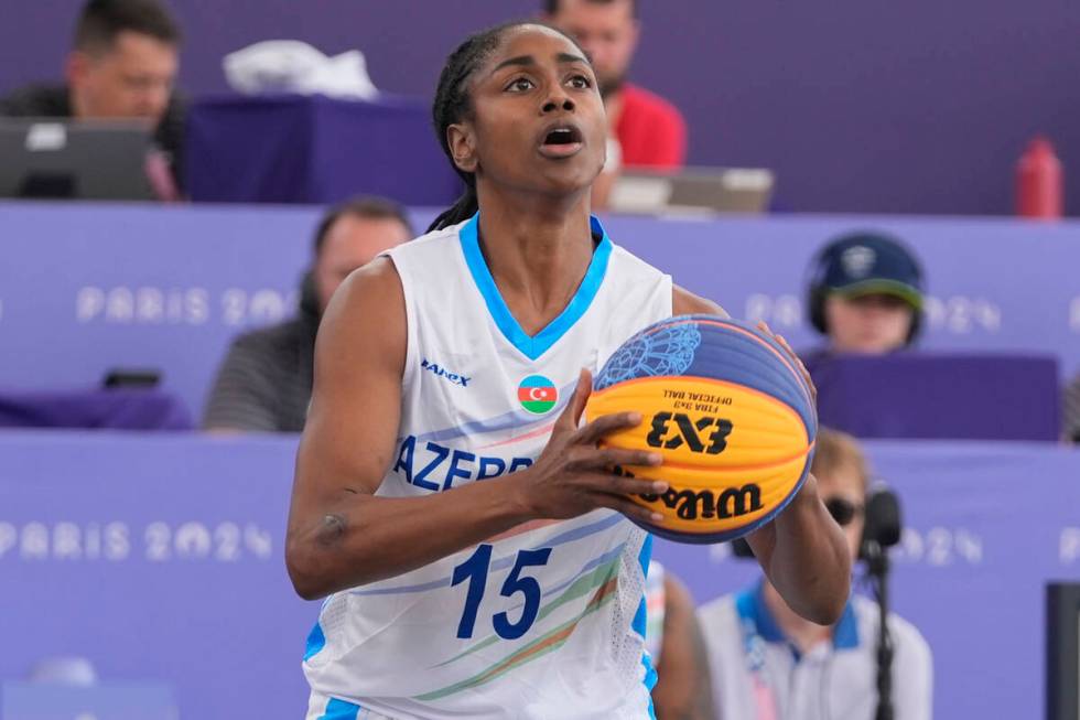 Azerbaijan's Tiffany Hayes (15) shoots the ball in the women's 3x3 basketball pool round match ...