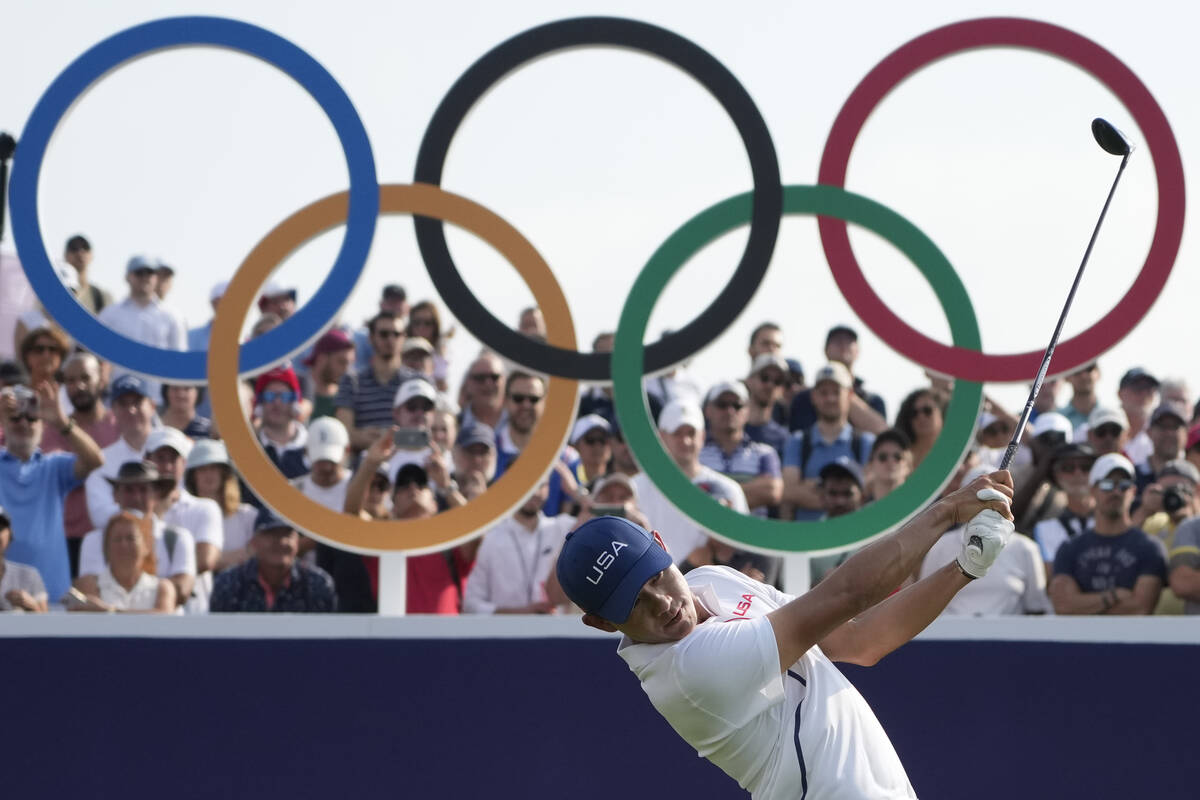 Collin Morikawa, of the United States, plays his tee shot on the 1st during the second round of ...