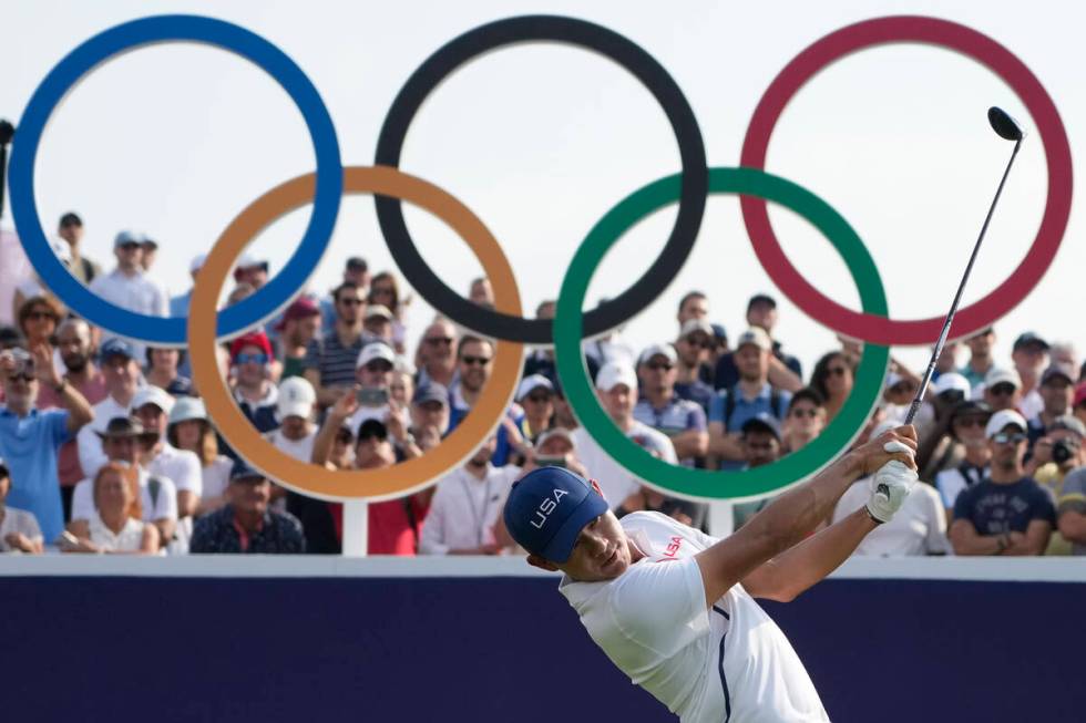 Collin Morikawa, of the United States, plays his tee shot on the 1st during the second round of ...