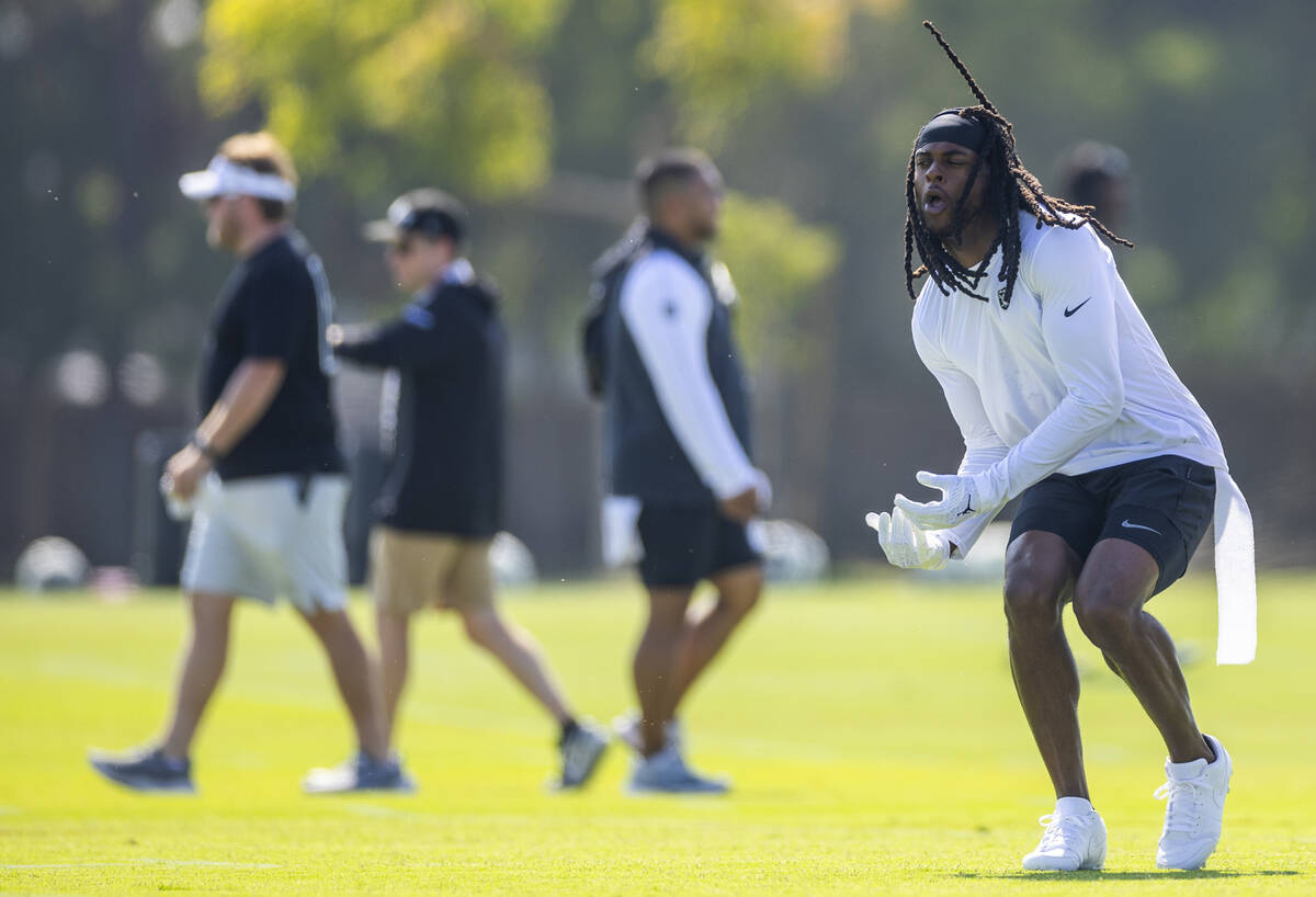 Raiders wide receiver Davante Adams (17) jokes around with teammates during the second day of R ...