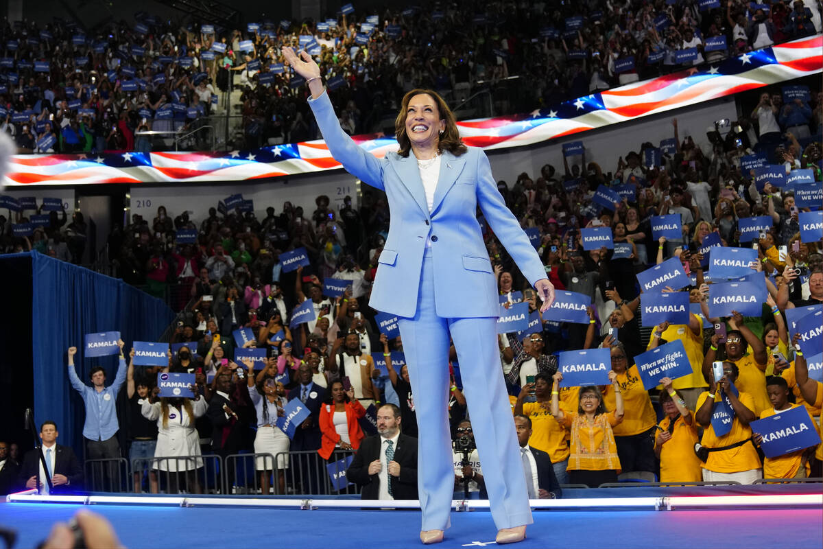 Vice President Kamala Harris waves during a campaign rally, July 30, 2024, in Atlanta. (AP Phot ...