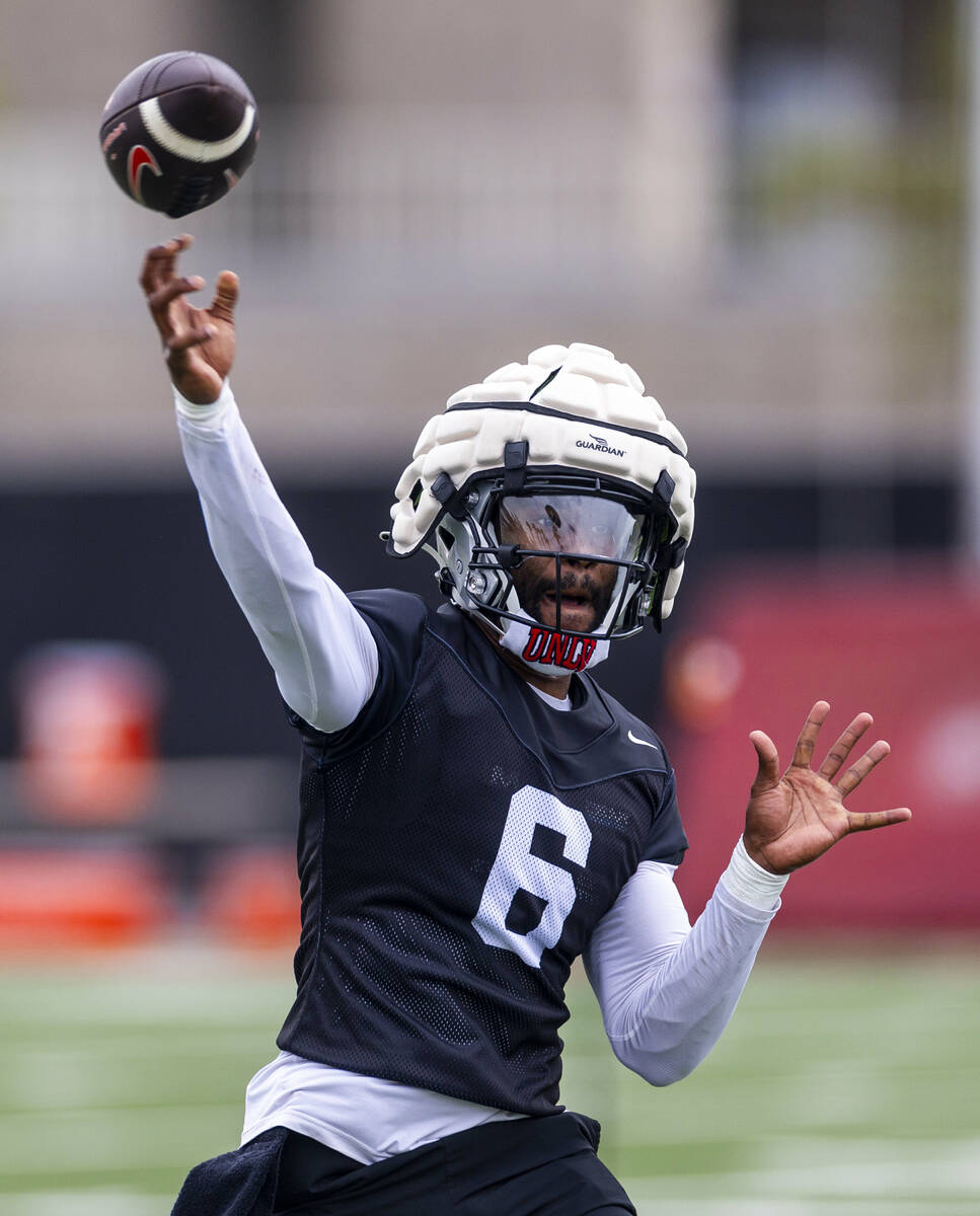 UNLV quarterback Hajj-Malik Williams (6) gets off a pass during the first day of football pract ...