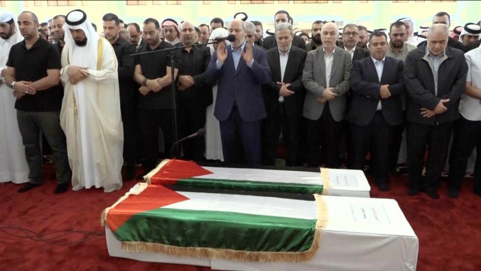 This video grab shows senior Hamas official Khalil al-Hayya, center, praying near the coffin of ...