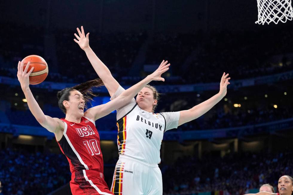 United States' Breanna Stewart, left, shoots as Belgium's Kyara Linskens defends during a women ...