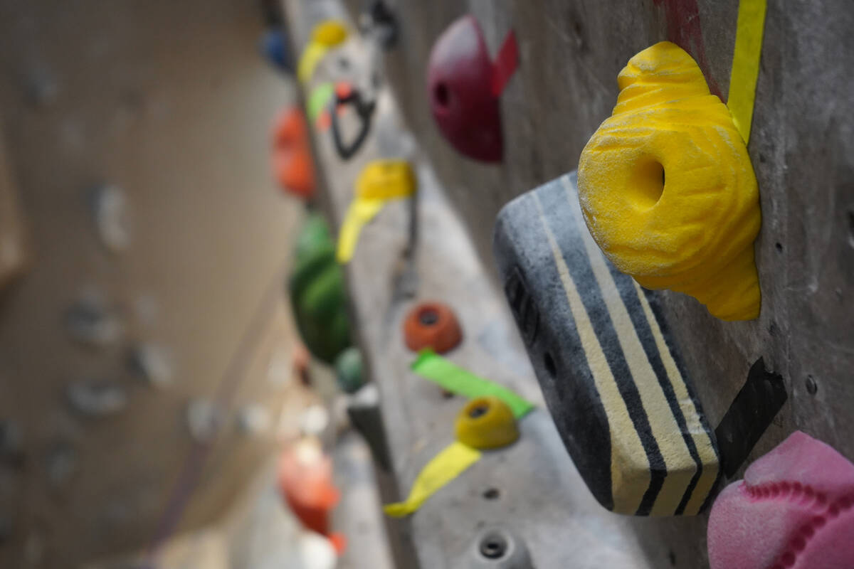 Colorful holds help provide balance as climbers figure out the puzzle in front of them. (Natali ...