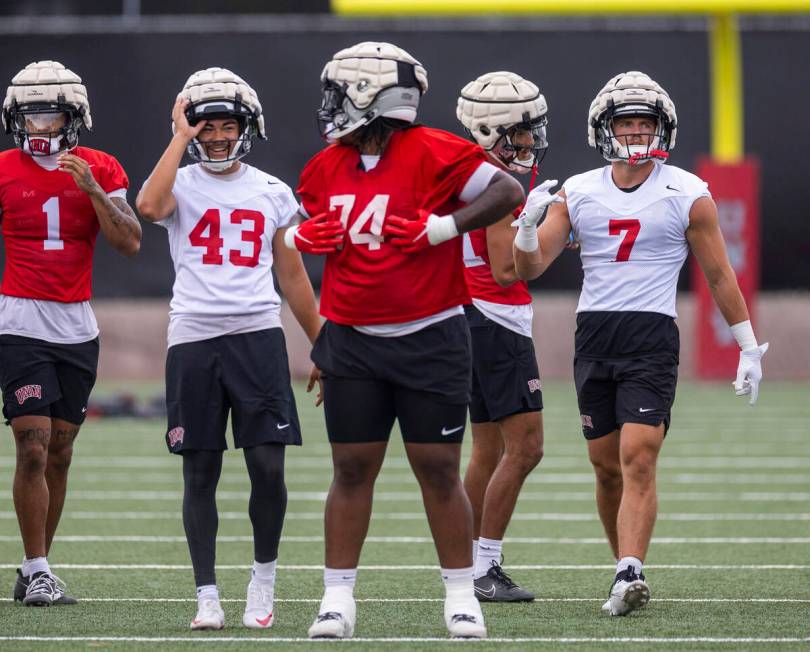 UNLV linebacker Jackson Woodard (7) warms up with teammates during the first day of football pr ...