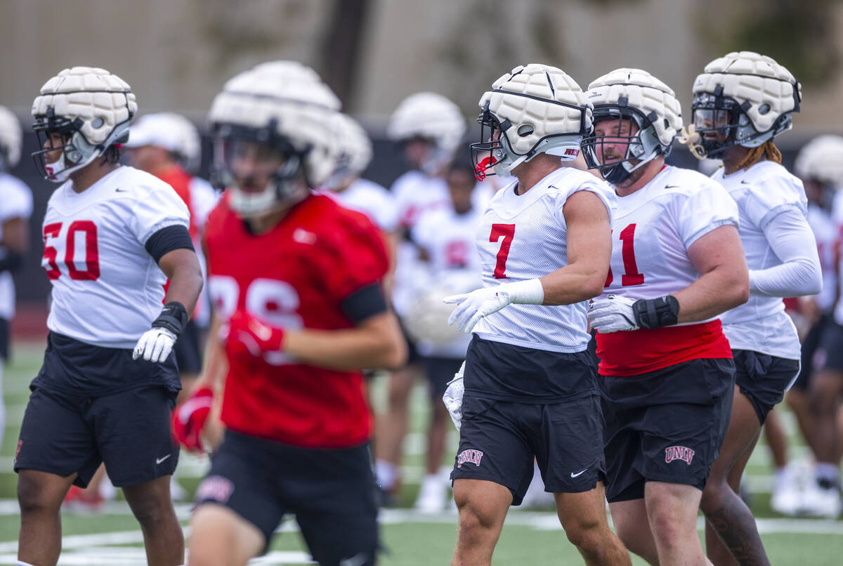 UNLV linebacker Jackson Woodard (7) runs to a drill with teammates during the first day of foot ...