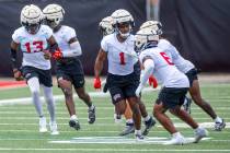 UNLV defensive back Jalen Catalon (1) runs a drill with teammates the first day of football pra ...