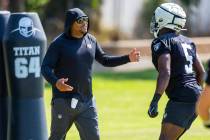 Raiders head coach Antonio Pierce works with linebacker Divine Deablo (5) on a drill during the ...