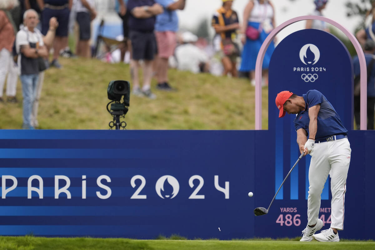 Collin Morikawa, of the United States, plays his tee shot on the 4th hole during the third roun ...