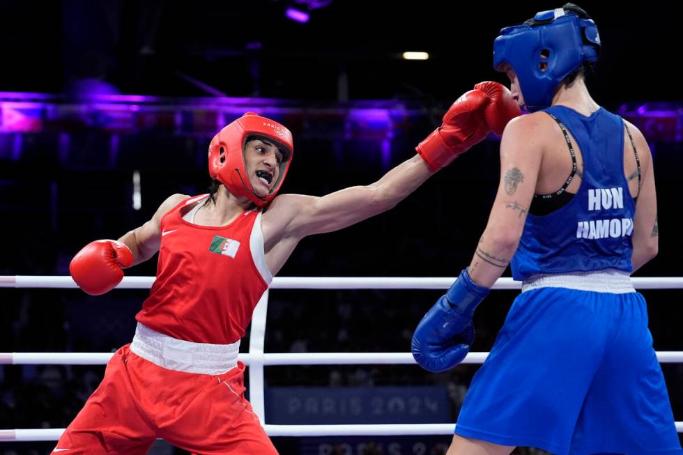 Algeria's Imane Khelif hits Hungary's Anna Hamori in their women's 66kg quarterfinal boxing mat ...