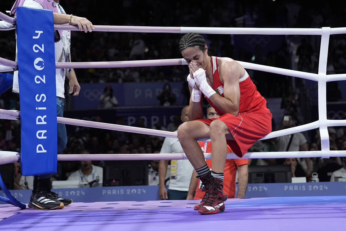 Algeria's Imane Khelif reacts after defeating Hungary's Anna Hamori in their women's 66kg quart ...